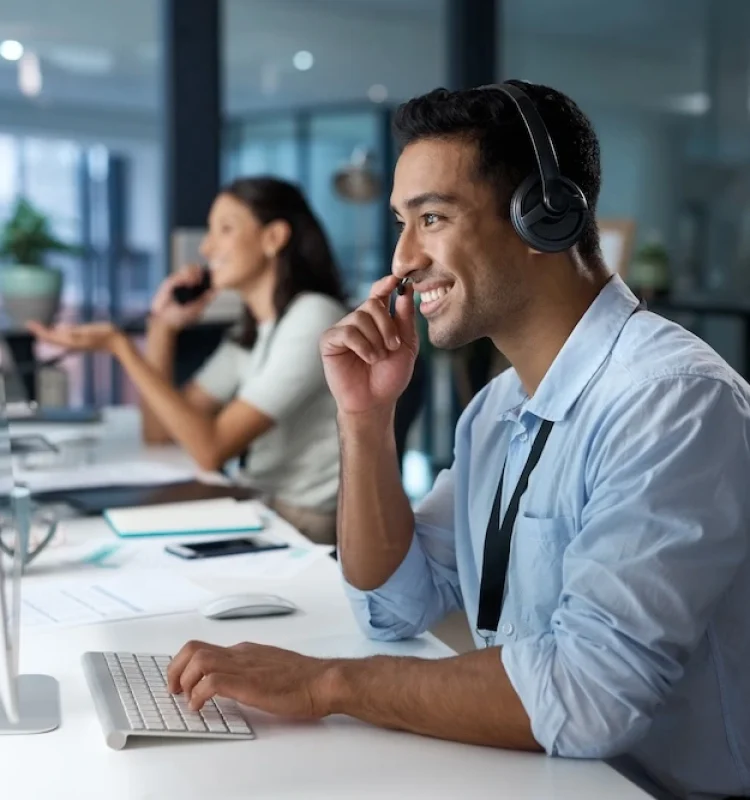 shot-of-a-young-man-using-a-headset-and-computer-i-2025-04-06-07-44-19-utc